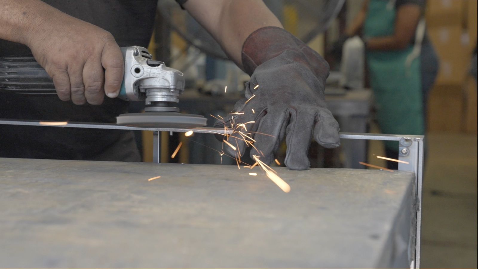 Grinding a metal part at an Elmsley Keystone facility